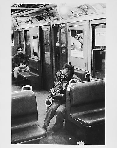 Man playing saxophone on subway 
mid 1950s
Gelatin Silver Print
