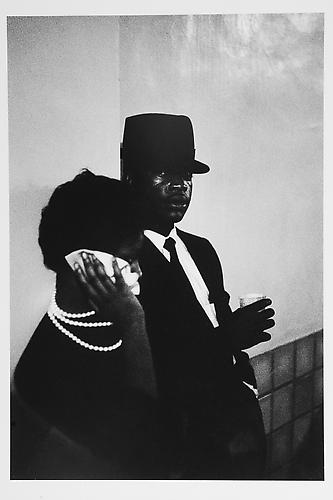 Woman, handkerchief to face, man looking at me
mid 1950s
Gelatin Silver Print