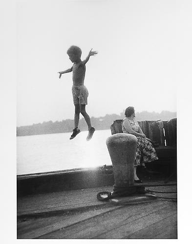 Boy jumping in mid-air on dock
mid 1950s
Gelatin Silver Print