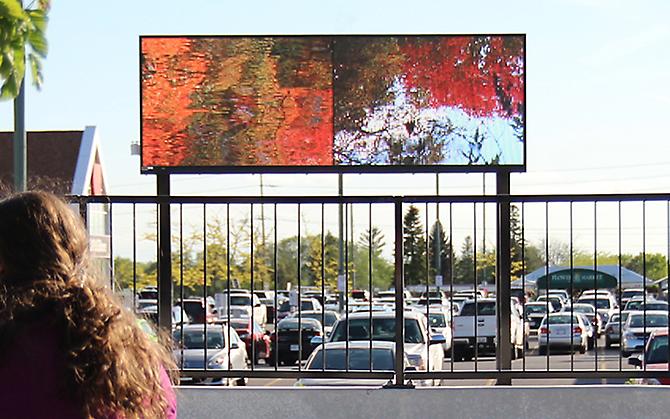 CHERYL PAGUREK | CURRENTS | PERMANENT PUBLIC ART COMMISSION | MARKET PLACE TRANSIT STATION, OTTAWA | VIDEO | 2011

Currents, a site-specific artwork by Cheryl Pagurek, was commissioned by the City of Ottawa's Public Art Program for the Market Place Transit Station. The first permanent outdoor video artwork in Ottawa, Currents employs the medium of video to embody the concepts of flow, movement, and community identity. A free-standing LED screen features video imagery of the Jock River, its currents, reflections, and seasonal changes, maintaining a link to the nearby body of water in an area of rapid urban development. Through the incorporation of historical images of the area, Currents celebrates the surrounding environment while commemorating times past. By locating the present site within a continuum, the video harkens to the past and preserves the present for future generations.