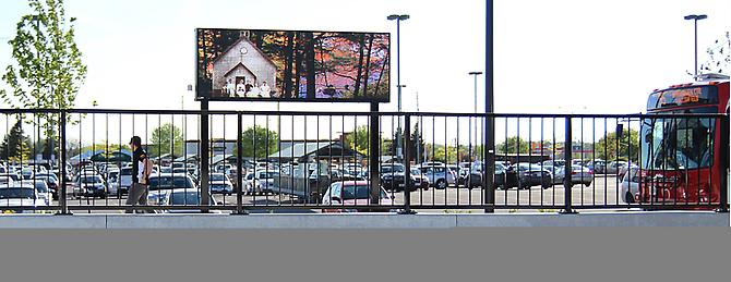 CHERYL PAGUREK | CURRENTS | PERMANENT PUBLIC ART COMMISSION | MARKET PLACE TRANSIT STATION, OTTAWA | VIDEO | 2011

Currents, a site-specific artwork by Cheryl Pagurek, was commissioned by the City of Ottawa's Public Art Program for the Market Place Transit Station. The first permanent outdoor video artwork in Ottawa, Currents employs the medium of video to embody the concepts of flow, movement, and community identity. A free-standing LED screen features video imagery of the Jock River, its currents, reflections, and seasonal changes, maintaining a link to the nearby body of water in an area of rapid urban development. Through the incorporation of historical images of the area, Currents celebrates the surrounding environment while commemorating times past. By locating the present site within a continuum, the video harkens to the past and preserves the present for future generations.