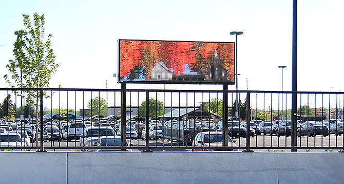 CHERYL PAGUREK | CURRENTS | PERMANENT PUBLIC ART COMMISSION | MARKET PLACE TRANSIT STATION, OTTAWA | VIDEO | 2011

Currents, a site-specific artwork by Cheryl Pagurek, was commissioned by the City of Ottawa's Public Art Program for the Market Place Transit Station. The first permanent outdoor video artwork in Ottawa, Currents employs the medium of video to embody the concepts of flow, movement, and community identity. A free-standing LED screen features video imagery of the Jock River, its currents, reflections, and seasonal changes, maintaining a link to the nearby body of water in an area of rapid urban development. Through the incorporation of historical images of the area, Currents celebrates the surrounding environment while commemorating times past. By locating the present site within a continuum, the video harkens to the past and preserves the present for future generations.
