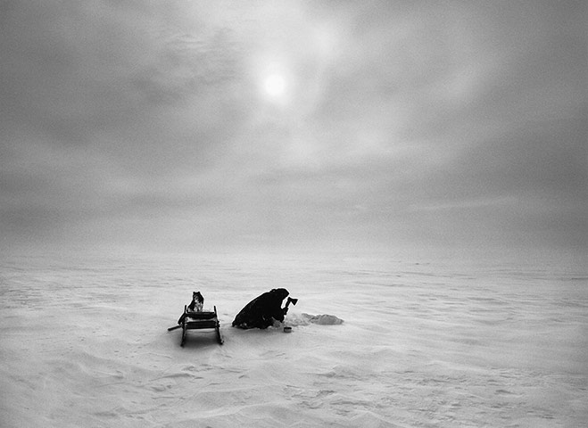 Ice cut out of a frozen lake is melted and the water used for cooking and drinking. The Nenets struggle to find enough fresh water and use it very sparingly, for instance rarely washing themselves.
gelatin silver print