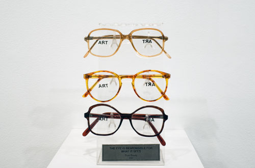 Paulo Bruscky, 2010 , The eye is responsible for what it sees , 3 pairs of glasses, stickers, acrylic
9.4 x 3.9 x 3.1 inches