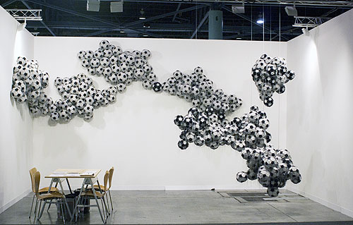  Obverse & Reverse , 2010, exhibition view, leather, string, and steel, dimensions variable, four wall modules and three hanging modules, Art Basel Miami Beach