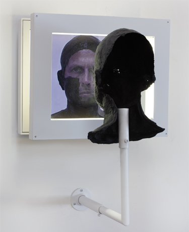 Plastron
LCD monitor, neon-light system, two way mirror, steel, plastic, plaster and paint
19 x 18 x 15 inches