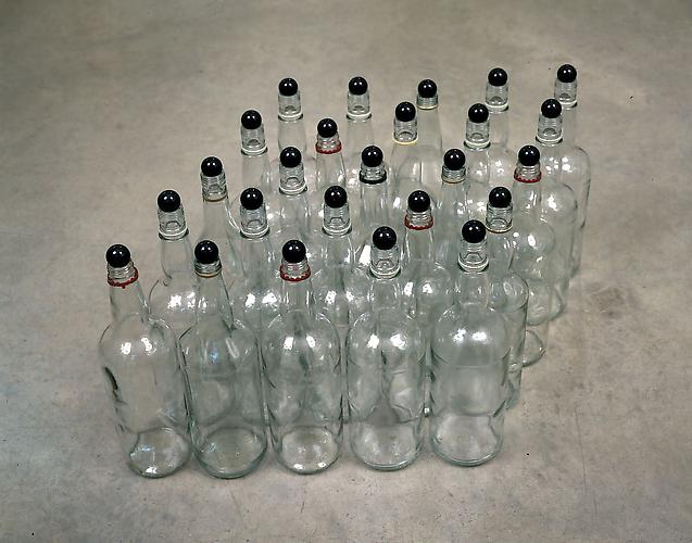 Tony Feher
Black Marquis 2000 
13 x 28 x 17 inches
25 glass bottles, plastic & painted metal neck rings, black marbles