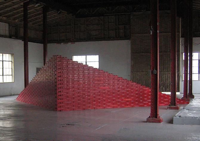 Tony Feher
Big Red Wedge 2005 
approximately 7 x 30 x 17 feet
2 x 9 x 5 meters 
red plastic soda cases