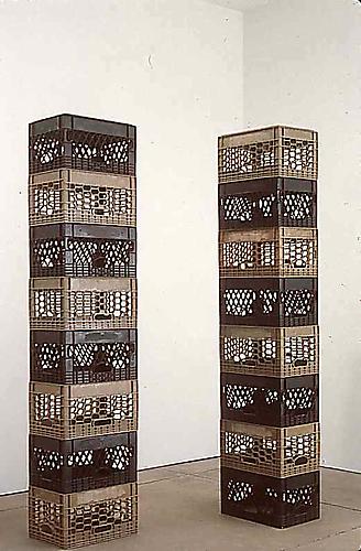 Tony Feher
Either/Or 1998 
each stack: 84 3/4 x 18 1/2 x 12 3/4 inches
 2 stacks of 8 alternating black and tan plastic packing crates