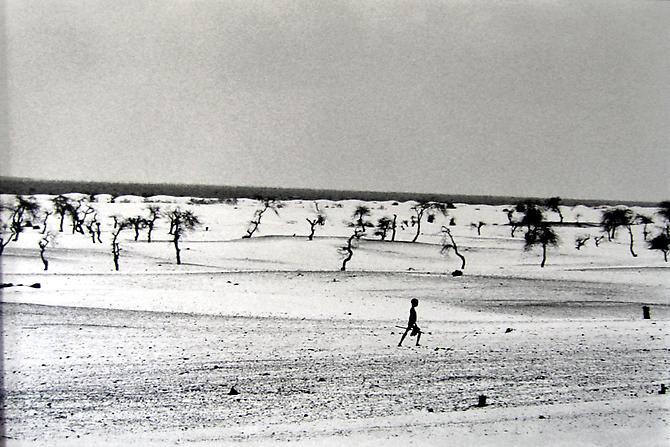 This used to be the large Lake Faguibine.  It dried up little by little with the drought and invasion of the desert.  All the men have gone, only the children, the elderly and women remain, Mali
1985
gelatin silver print