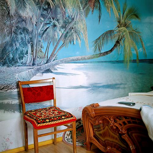 OLGA CHAGAOUTDINOVA | CHAIR AT THE BEACH IN THE BEDROOM | C-PRINT | 61 x 61 CENTIMETERS | 2006