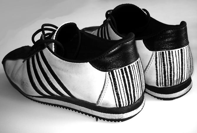 Mike Latham
Arts Corporation Trainers   2007
Edition of 3
Leather, string, cord
9.5 x 3.5 x 3.5 in