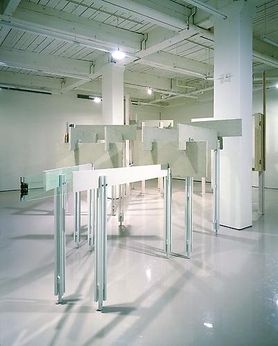 Heather Rowe
On Returning, 2007
steel, stucco, sheetrock, found window frames and door frames, shag carpet, wood, mirror, glass, hinge and curtain