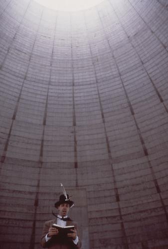 Jay Critchley, Bible reading by artist, abandoned nuclear power plant cooling tower, Tennessee Valley Authority, 1988.