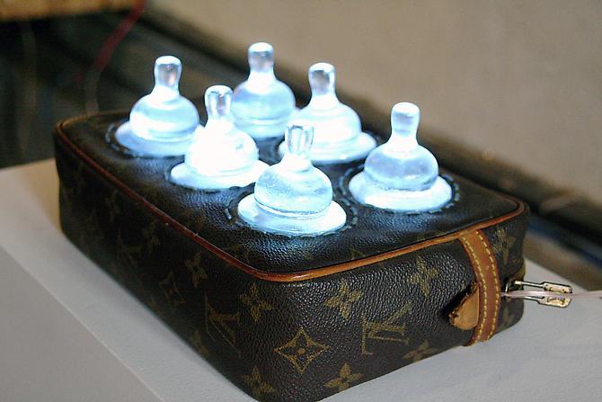 Six Pack #9, 2011, 4.5” h x 9” l x 6”w
Vintage Louis Vuitton, cast glass baby bottle nipples, LEDs, battery pack
4.5 x 9 x 6 inches