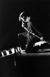 Alfred Wertheimer, Kneeling at the Mosque, Elvis performs live before 3,000 of his loyal fans at the Mosque Theatre, Richmond, Virginia
June 30th, 1956
