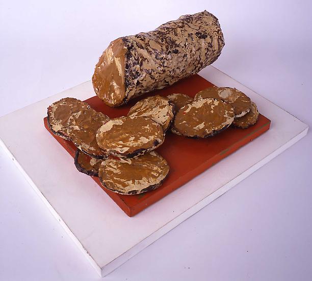CLAES OLDENBURG
"Liver Sausage & Slices"
1961
Muslin soaked in plaster over wire frame, painted with enamel in 11 parts, on its original enamel-painted wooden base
5 x 10 x 12 inches (12.5 x 25.5 x 30.5 cm)