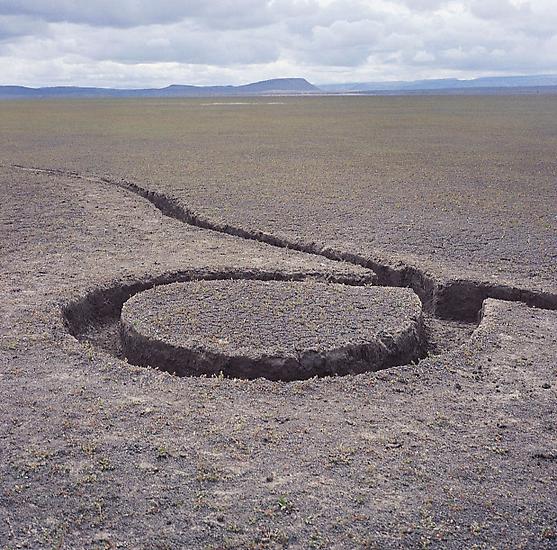 Michael Heizer, "Isolated Mass / Circumflex," 1968 (deteriorated). #9 of Nine Nevada Depresssions. 6 ton displacement in playa surface, 12 x 12 x 1 feet. Location: Massacre Dry Lake, Vya, Nevada