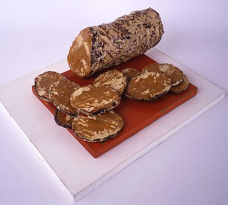 CLAES OLDENBURG
"Liver Sausage & Slices"
1961
Muslin soaked in plaster over wire frame, painted with enamel in 11 parts, on its original enamel-painted wooden base
5 x 10 x 12 inches (12.5 x 25.5 x 30.5 cm) Image
