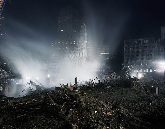 The North Tower shroud in smoke and spray