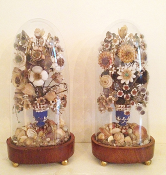 <font size=3>INDIAN SUMMER - <font size=2>A pair of Regency shell floral dioramas under hand-blown glass domes on wooden circular plinths.