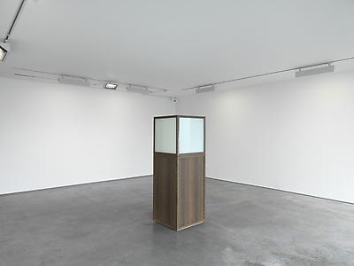 Ryan Gander
<i>Kodak Courage,</i> 2012
Oak display vitrine, Smart glass
170 x 60 x 60 cm
