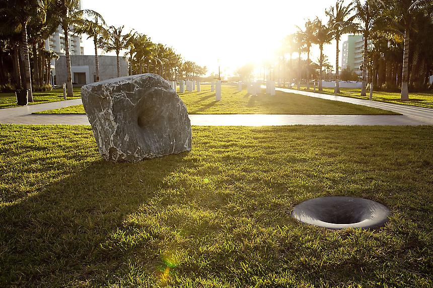 <b>ANISH KAPOOR</b>
<i>Black Stones, Human Bones</i>, 1993
Large stone: 58 x 68 x 58 inches (147.3 x 172.7 x 147.3 cm)
Small stone, diameter: 36 inches (91.4 cm)  
Small stone, depth: 30 inches (76.2 cm)
Distance between stones: 94 inches (238.8 cm)