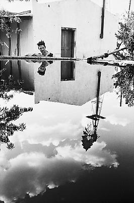 <b>A railway shunter who dreamed of a garden without concrete or bricks, watered by this dam on his plot, or small-holding, Koksoord, Randfontein</b>, 1962. Image
