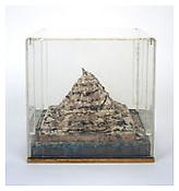 Dieter Roth (1930-1998)
<i>Ins Meer, Schimmelberg / Into the Sea, Mold Mountain</i>
1969
Plaster, paper, chocolate, yogurt, and fruit juice, mounted on metal in original Plexiglas vitrine
7 7/8 x 11 3/4 x 11 3/4 inches; 20 x 30 x 30 cm