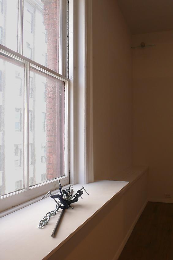 Richard Wentworth<br />Heiroglyph<br />2010<br />galvanized steel, chain and C-clamps<br />approx. 7 1/2 x 38 x 16 inches<br />(19 x 96.5 x 40.6 cm)<br />