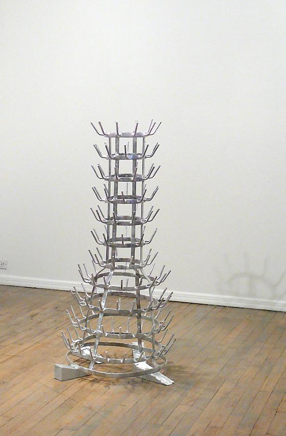 Richard Wentworth<br />The Exceptionally Long Letter<br />2010<br />galvanised steel bottle rack, plastic wrap and painted wood<br />48 x 25 1/2 x 25 1/4 inches<br />(122 x 65 x 64 cm)<br />