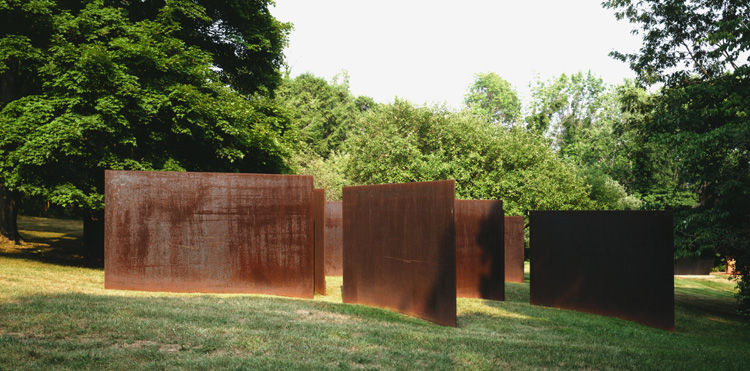 Richard Serra<br />Five Elevations<br />1972-74<br />hot rolled steel, twelve plates <br />each:  96 x 145 x 3/4 inches (244 x 368 x 2 cm)<br />overall: 10 foot 5 inches x 42 x 42 feet  (3.18 x 12.8 x 12.8 meters)<br />