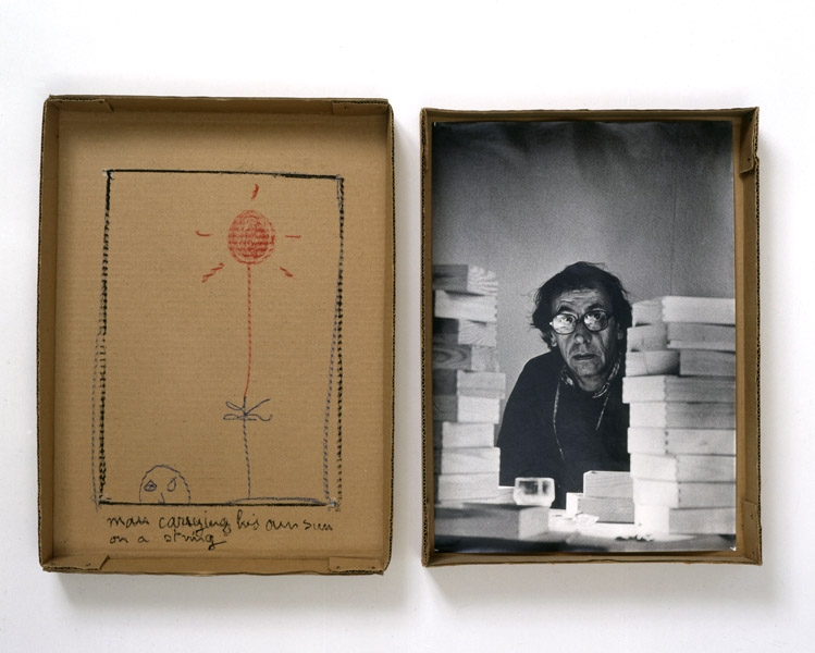 Robert Filliou<br />Man Carrying his Own Sun on a String<br />1973<br />cardboard box in two parts, photograph<br />and pastel<br />top: 17 5/8 x 13 x 2 1/4 inches<br />(44.8 x 33 x 5.7 cm)<br />bottom: 16 7/8 x 12 1/2 x 2 3/8 inches<br />(42.9 x 31.8 x 6 cm)<br />