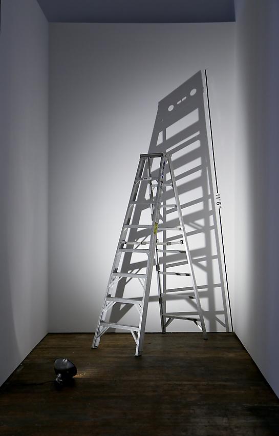 Mel Bochner<br />Measurement: Shadow<br />1969<br />ladder, lamp on floor, and vinyl on wall<br />size determined by installation<br />
