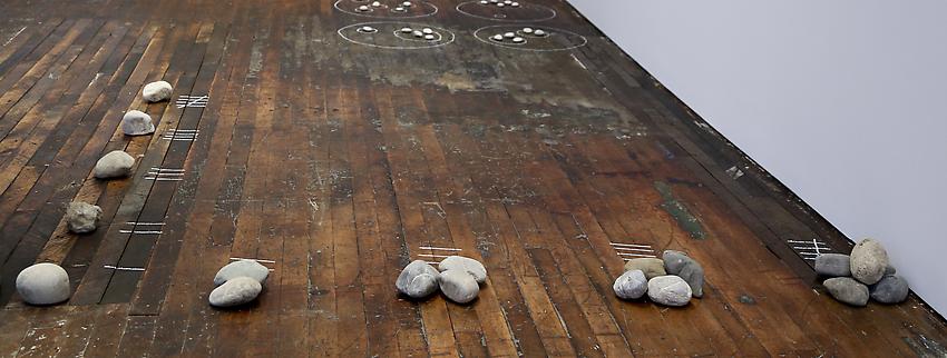 Mel Bochner<br />Five By Four<br />1972<br />stones and chalk on floor<br />size determined by installation<br />