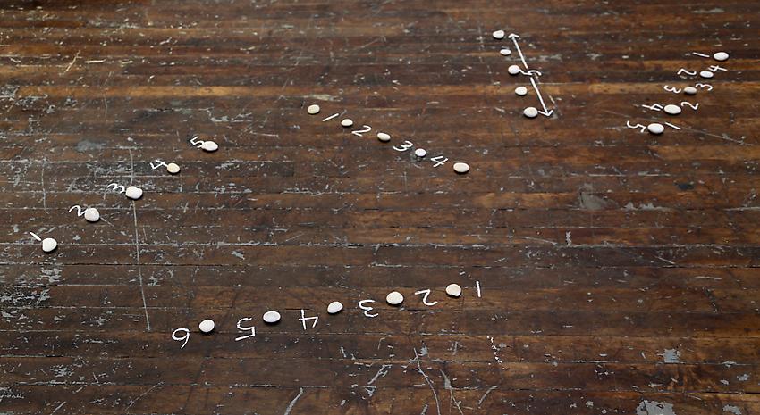 Mel Bochner<br />Five Sculptures<br />1972<br />stones and chalk on floor<br />size determined by installation<br />