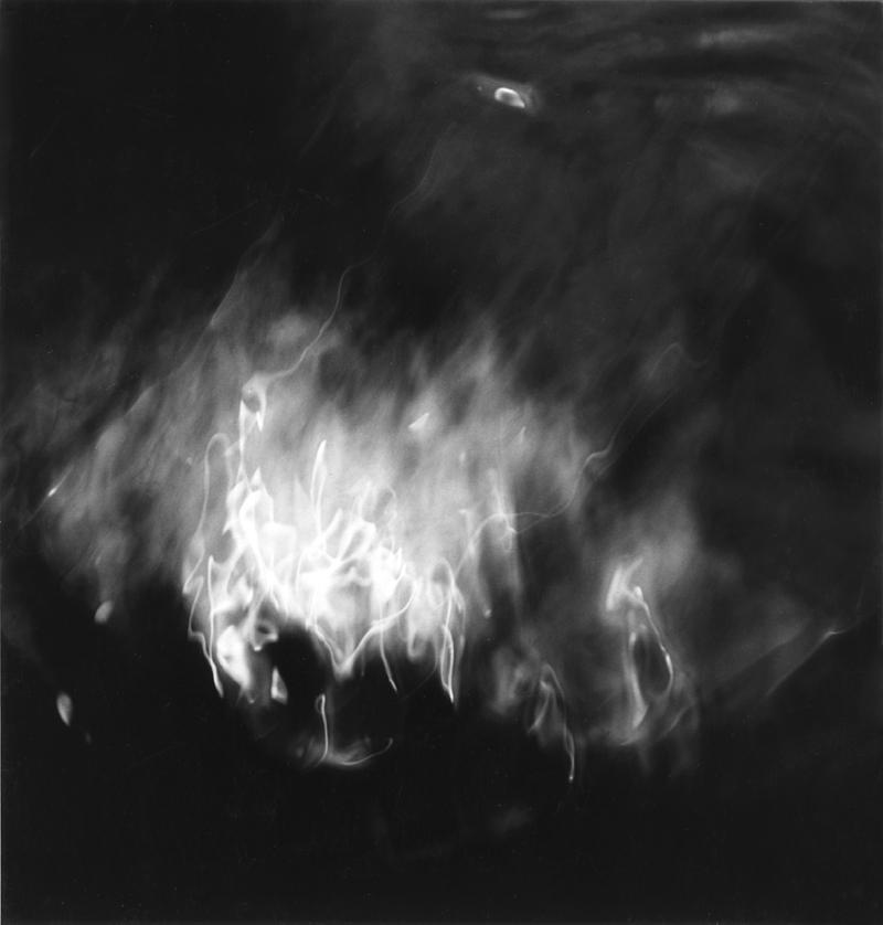 Ralph Eugene Meatyard<br />Lite #12<br />1960<br />gelatin silver print<br />image and sheet: 5 3/4 x 5 1/2 inches  (14.6 x 14 cm)<br />