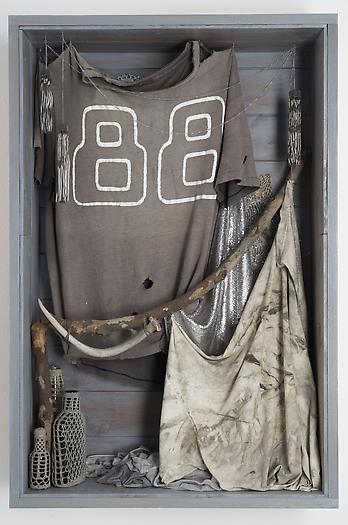 Untitled (88), 2006-2008
Wood, cotton t-shirts, glass bottles, antler, metal chain, fabric, glitter
36 x 24 x 7 1/2 inches
91.44 x 60.96 x 19.05 cm