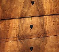 A Walnut Veneered Commode
