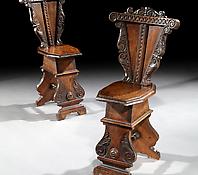 A Pair of Carved Walnut Sgabello Chairs
