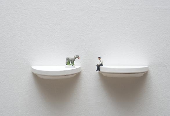 Dialogue with sitting man, 2011
Diptych, figurines on two wooden shelves, wall installation
2 x 8 3/4 x 2 inches Image