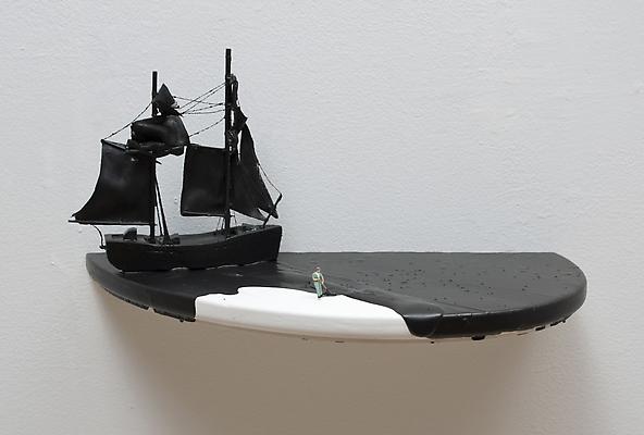 Black Spill (man in green outfit), 2011
Figurine, ship, and acrylic on wooden shelf, wall installation
6 3/4 x 14 x 7 1/2 inches Image