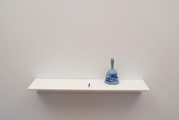 To Go Back (blue bell), 2011
porcelain bell, figurine, ink, and shelf
9 x 24 x 6 inches Image